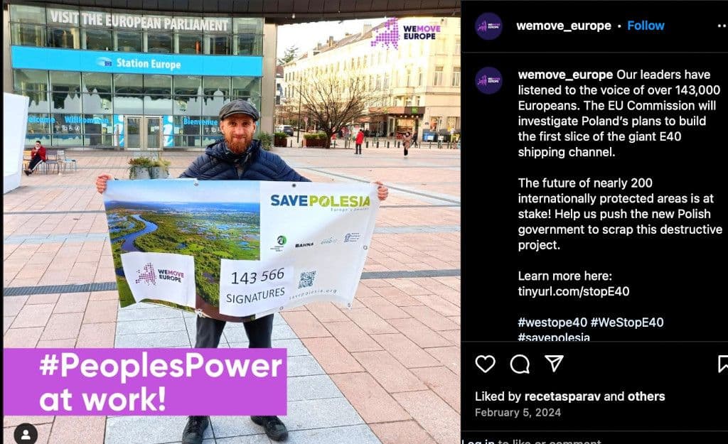 Marek, from our partner OTOP, holds a banner displaying our petition’s signature count before presenting our case to the Environment Commissioner at the European Parliament.