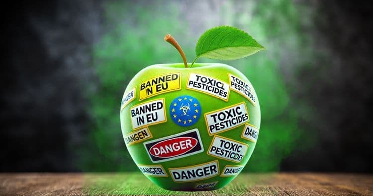 Image of a green apple with lables saying "danger", "toxic pesticides", etc. 