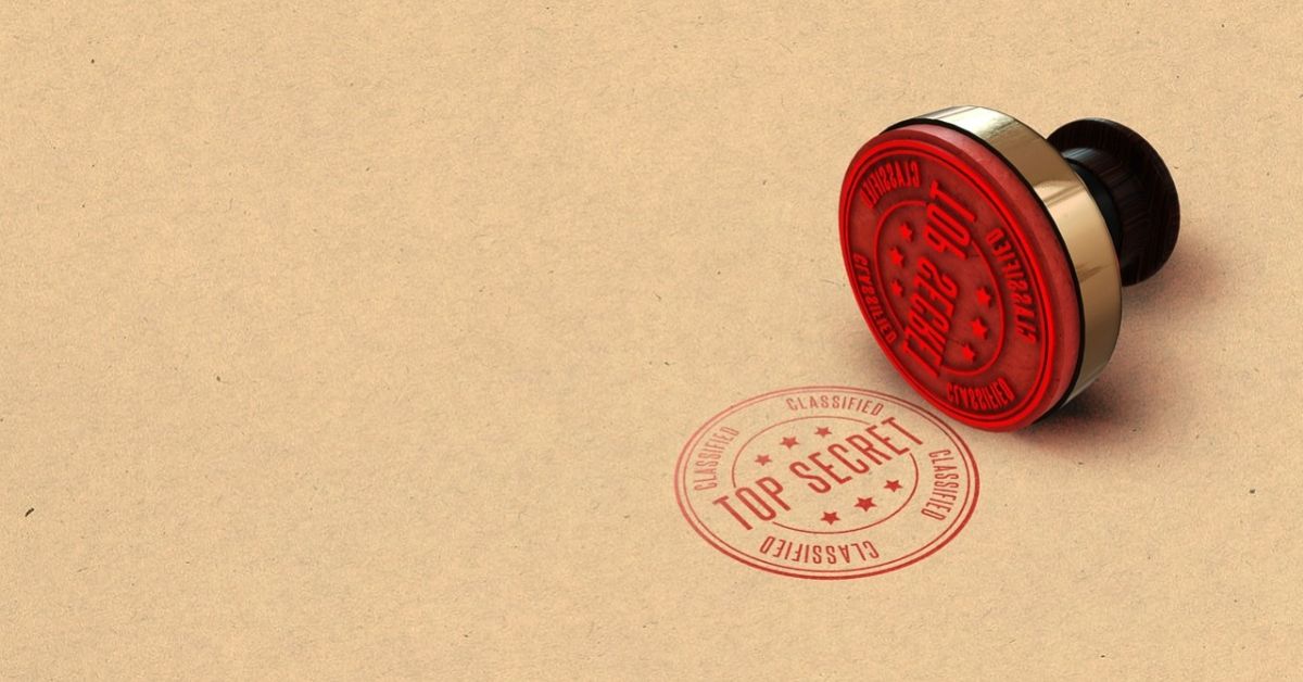 Abbildung eines roten runden Gummistempels mit der Aufschrift "Top Secret".